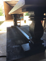 Milled trestle base dining table