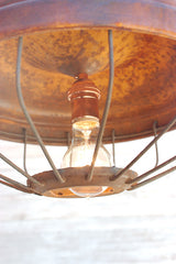 Repurposed chicken feeder light fixture