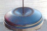 Repurposed chicken feeder light fixture